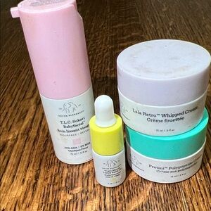 Drunk Elephant Skincare Collection with Pink and Yellow Highlights